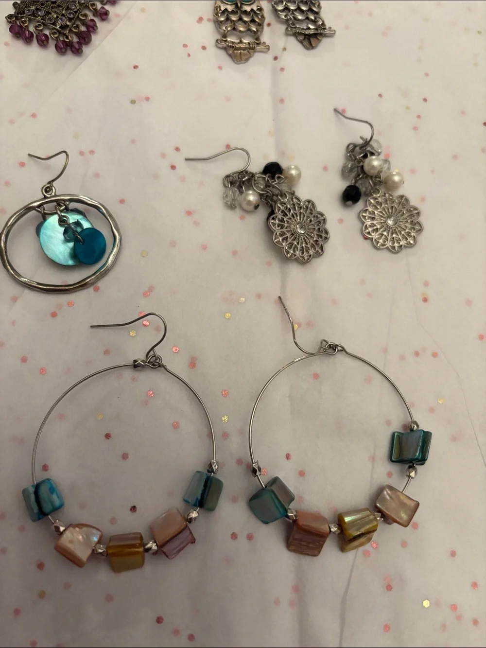 10 pair of assorted‎ earrings.